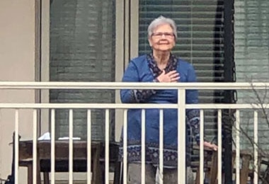 Daily balcony gathering brings this senior community together safely